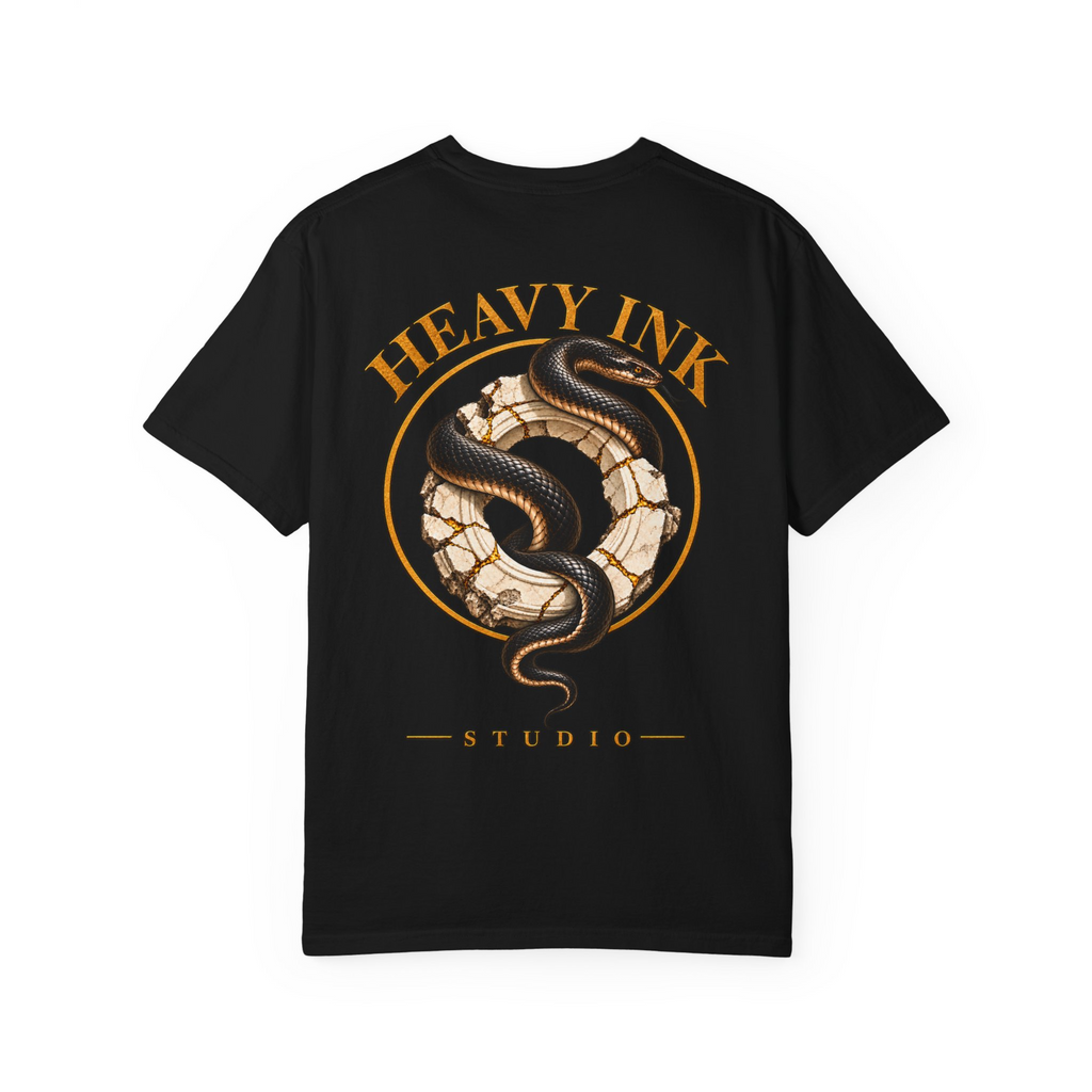 Gilded Serpent tee in Black, back view with a black serpent wrapped through a cracked ivory stone ring, gold halo and Heavy Ink Studio lettering
