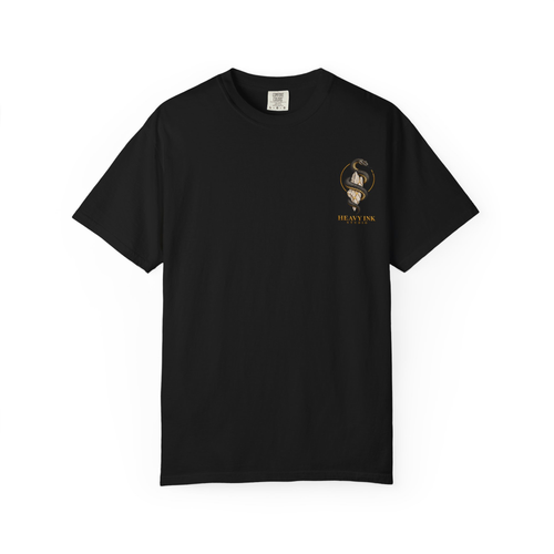 Statue & Serpent tee in Black, front view with a small snake wrapped around a stone fragment and Heavy Ink Studio wordmark